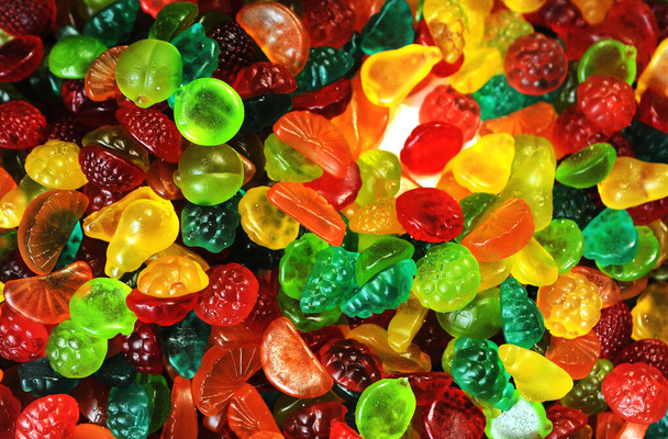Deliziose caramelle colorate gelatina su sfondo  - Foto, immagini