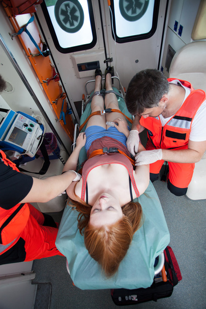 Paramedics using medical equipment - Foto, imagen