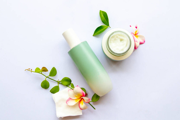 the therapy toners with nourish cream extract herbal cosmetics beauty health care for skin face of lifestyle woman arrangement flat lay style on background white - 写真・画像