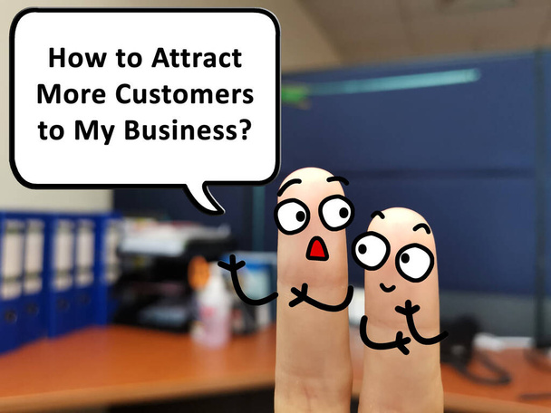 Two fingers are decorated as two person. One of them is asking how to attract more customers to his business. - Фото, изображение