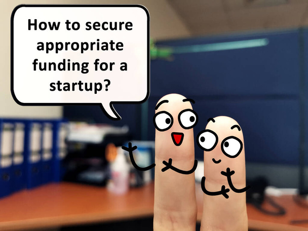 Two fingers are decorated as two person. One of them is asking how to secure appropriate funding for a startup. - Фото, изображение