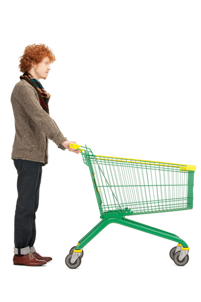 Man with shopping cart - Фото, изображение