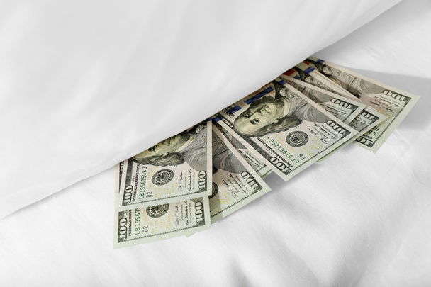 Hidden money under pillow close up - Foto, Bild