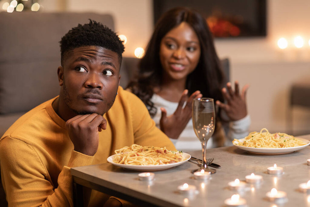 African Man Ignoring Girlfriend During Conversation Celebrating Valentine At Home - Photo, image