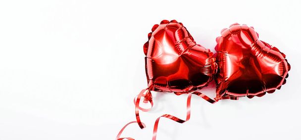 Banner. Red heart foil balloon on white Valentines Day background. Copyspace. - Photo, Image