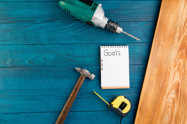 New Year goals for 2022, plumbing tools and notebook in workshop - Photo, Image