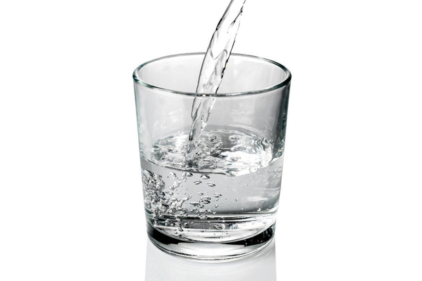 fresh water pouring into the glass isolated on white - Photo, Image
