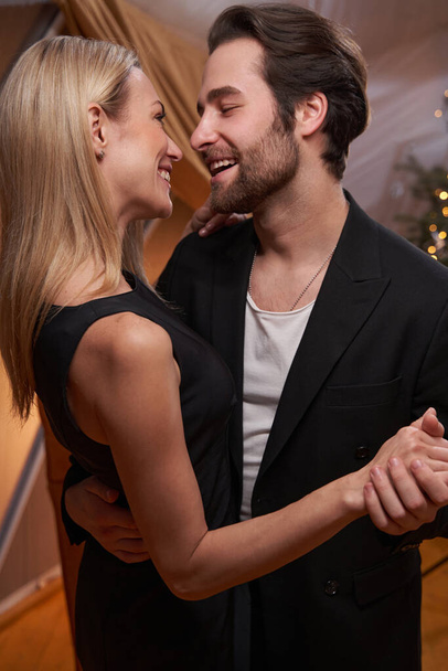Cheerful couple is dancing on romantic date - Fotografie, Obrázek