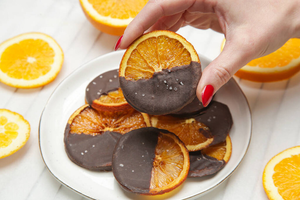 Dark chocolate dipped dry orange slices - Zdjęcie, obraz