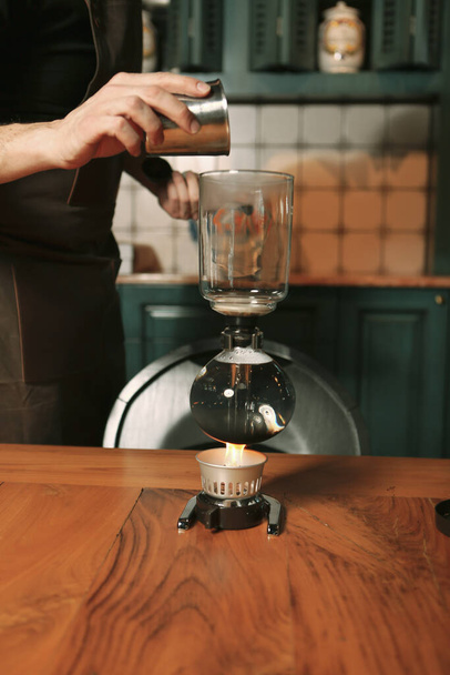 barista brewing coffee in the coffee room - Photo, image