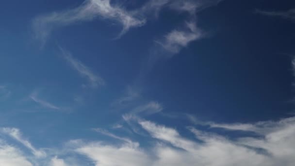 8K 7680x4320.Only cirrus clouds in the blue sky. Fibrous clouds are similar to cirrus uncinus, commonly known as mares tails however, fibratus cloud do not have tufts or hooks at the end.time lapse, cinematic, background, landscape, view, nature. - Video