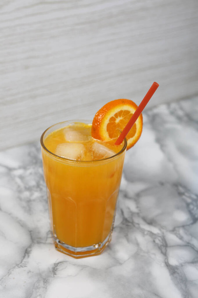 A glass of tasty orange juice - Fotografie, Obrázek