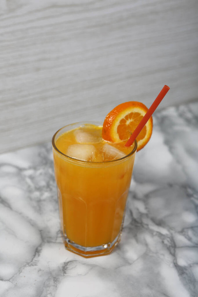 A glass of tasty orange juice - Φωτογραφία, εικόνα