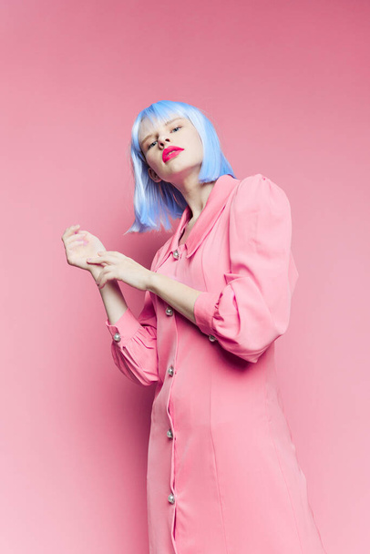 fashionable woman wears a blue wig makeup isolated background - Zdjęcie, obraz