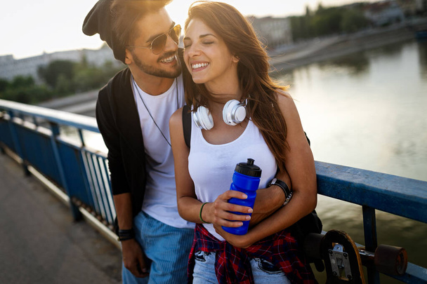 Portrait of happy young couple in love enjoying time together in city. People travel fun happiness concept - Valokuva, kuva