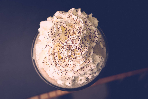 Glass of raspberry milkshake with whipped cream and fresh raspberries - Fotografie, Obrázek