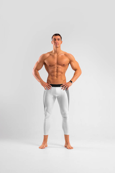Man athlete isolated on white background. Gym full body workout. Muscular man athlete in fitness gym have havy workout. Sports trainer on trainging. Fitness motivation. - Zdjęcie, obraz