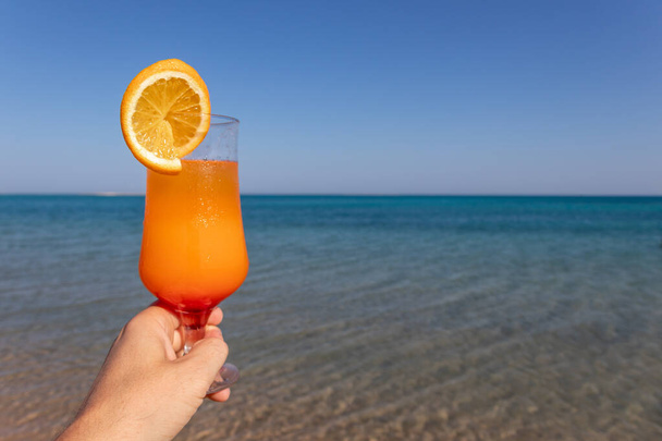 Iced mocktails glass on the beach. Cocktail on beach. - 写真・画像