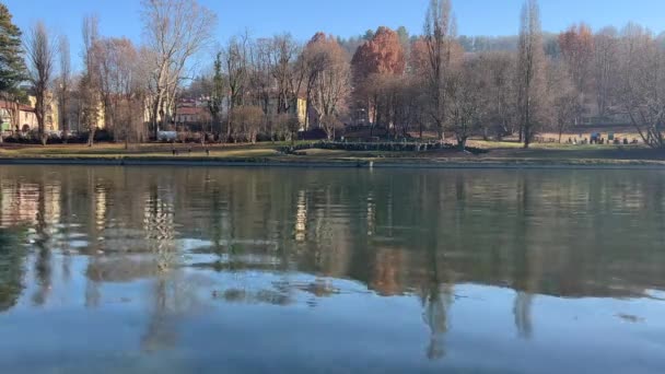 landscape over the river Po in Turin seen from the Valentino park in Turin , italy - Materiał filmowy, wideo