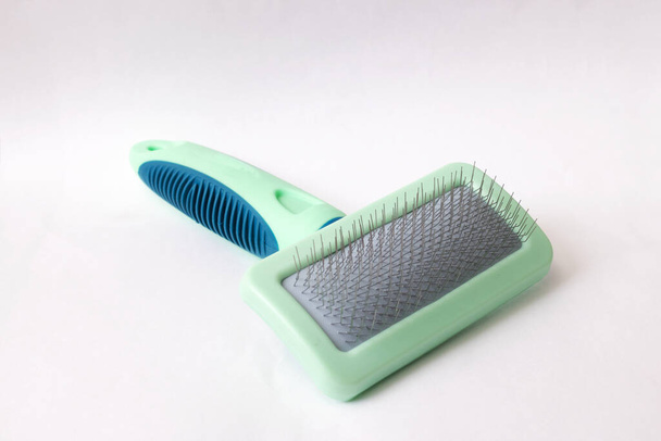 Green animal comb on white background close up - Photo, Image