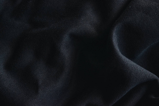 Close up photo of black textile, sweatshirt fabric. - Foto, Bild