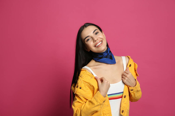Fashionable young woman in stylish outfit with bandana on pink background, space for text - Foto, immagini