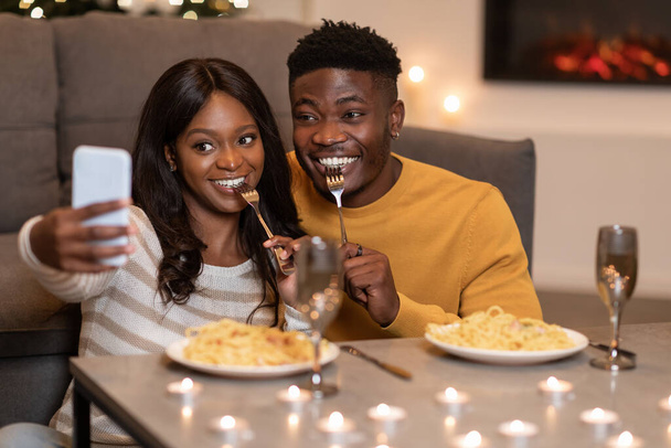 African Spouses Using Smartphone Making Selfie Celebrating Valentine At Home - Photo, image