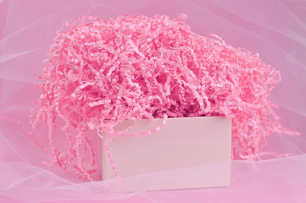 Calm pink background with tissue paper in present box. High quality photo - Foto, Imagem
