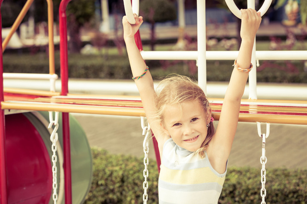 Happy little girl on the playground - Zdjęcie, obraz