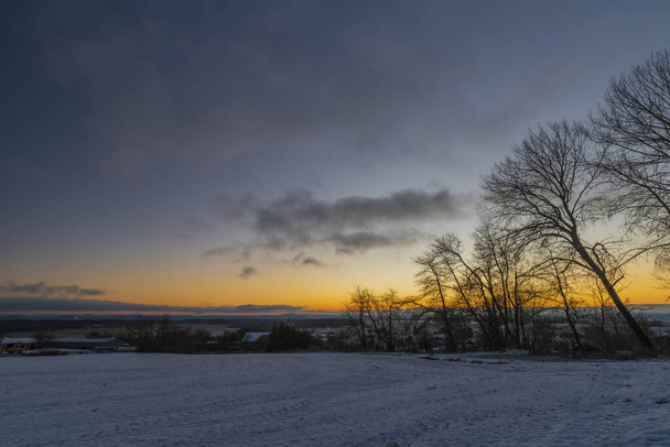 Sunrise near Ctibor and Halze villages in cold snowy orange morning - Foto, afbeelding