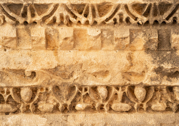 ancient weathered stone-cut ornament on the ruins of a building in the ancient city of Mira, Turkey - Photo, image
