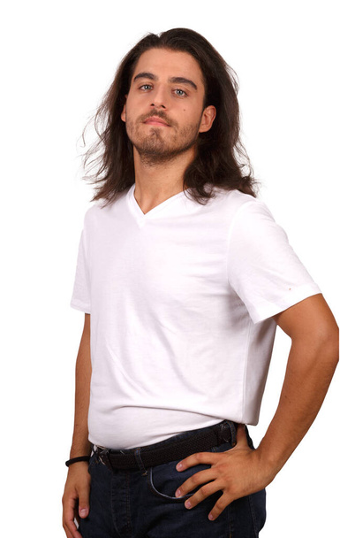 young man in white T-shirt with white background making funny gestures - Photo, image