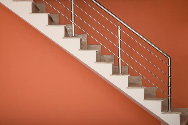 Modern aluminum stairs going upwards in new house interior. - Photo, image