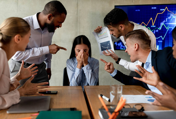 Workplace Mobbing. Asian Female Suffering Bullying From Colleagues In Office - Foto, imagen