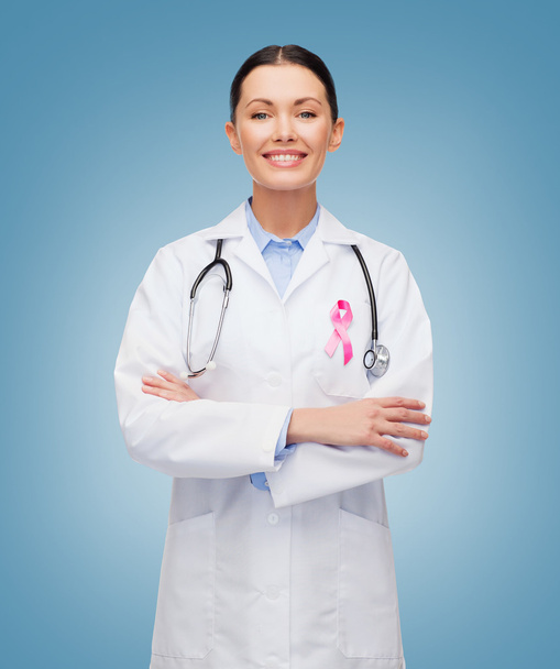 doctor with stethoscope, cancer awareness ribbon - Foto, imagen