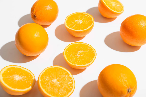 Fresh ripe cut oranges on white background, closeup - Фото, зображення