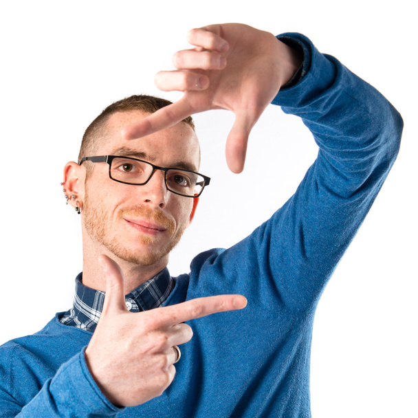 Man focusing with his fingers on a white background  - Photo, image