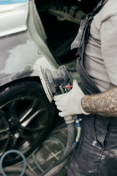 car polishing with a special nozzle in the workshop - Фото, зображення