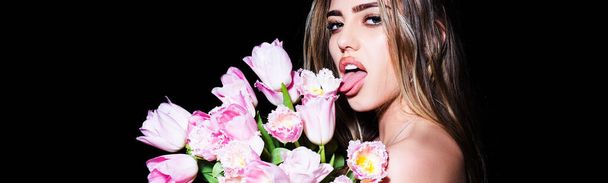 Spring woman face for banner. Sensual girl with tongue tulips. Blowjob kiss, sensual tongue licks a tulip flower. Sexy female mouth and spring flower. Isolated on black. - Zdjęcie, obraz