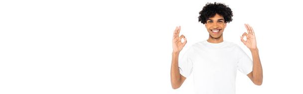 happy african american man in t-shirt showing okay signs isolated on white, banner - Фото, изображение