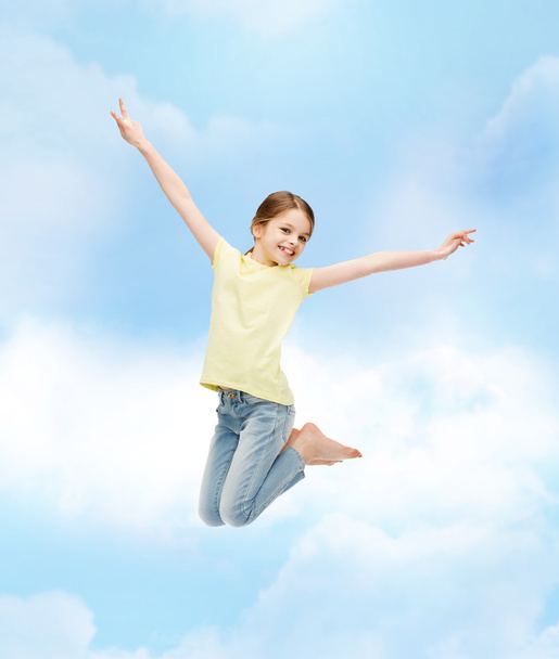 smiling little girl jumping - Photo, image