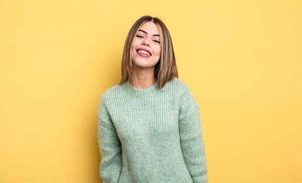 pretty caucasian woman with a big, friendly, carefree smile, looking positive, relaxed and happy, chilling - Foto, afbeelding