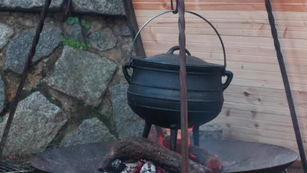 close-up shot of metal cauldron on fire - Кадры, видео