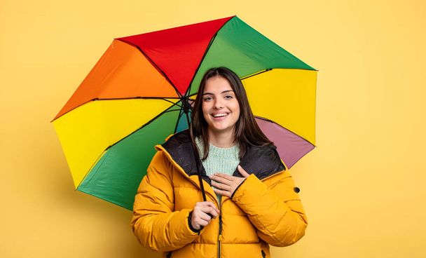 pretty woman laughing out loud at some hilarious joke. winter and umbrella concept - 写真・画像