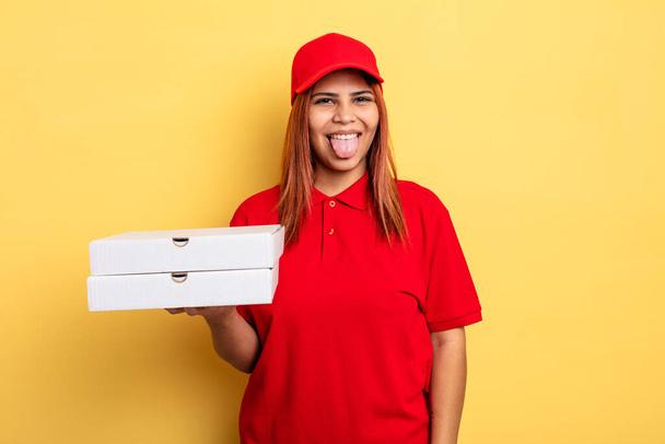 hispanic woman with cheerful and rebellious attitude, joking and sticking tongue out. take away deliver concept - Zdjęcie, obraz