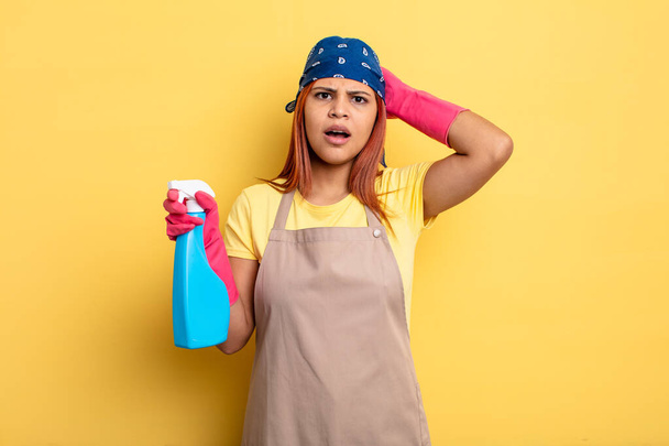 hispanic woman feeling stressed, anxious or scared, with hands on head. cleaning and housekeeper concept - Foto, Bild