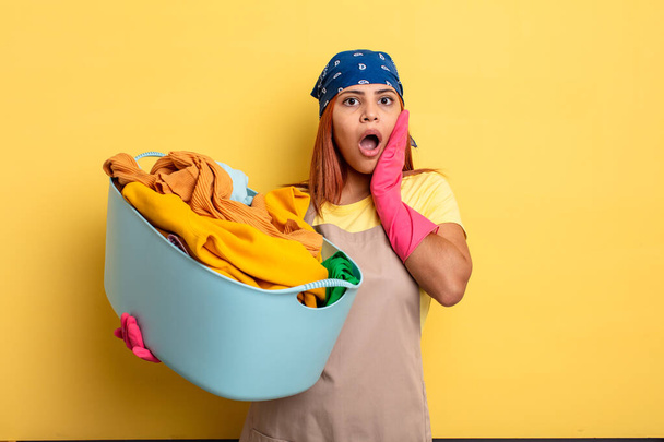 housekeeper feeling shocked and scared. washing clothes concept - Foto, immagini