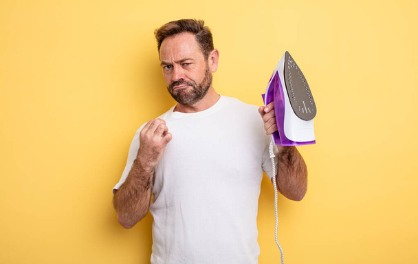 middle age man looking arrogant, successful, positive and proud. clothes iron concept - Φωτογραφία, εικόνα