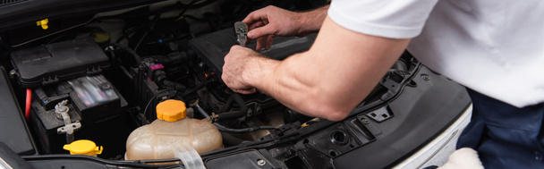 Cropped view of mechanic working with auto in service, banner  - Фото, зображення