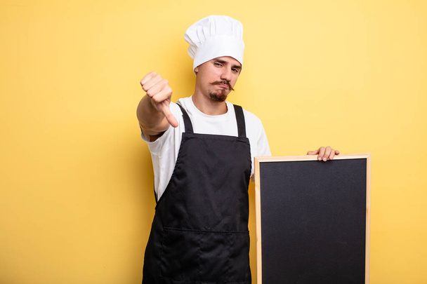 chef man feeling cross,showing thumbs down - Foto, Imagem
